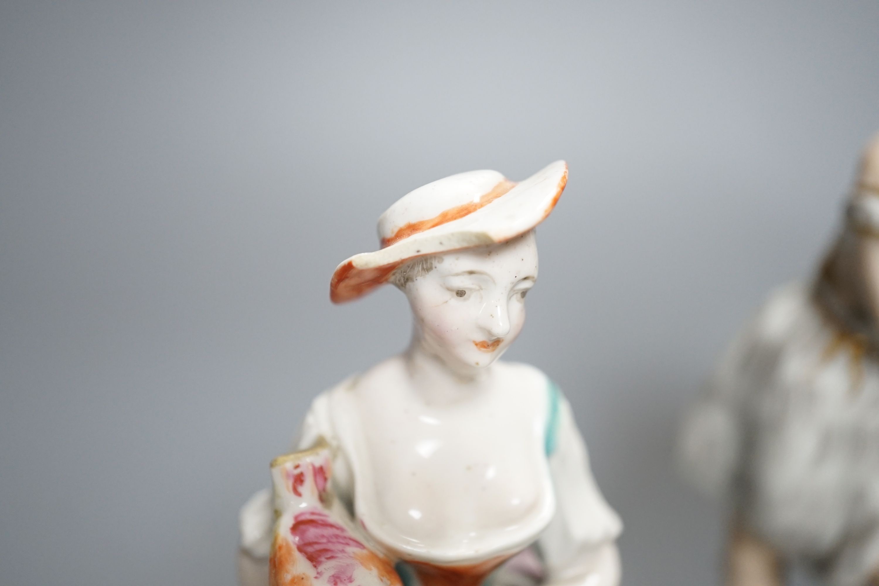 A Chelsea-Derby bocage figure, 16cm, 19th century pearlware figure of Cupid disguised and one other Staffordshire figure